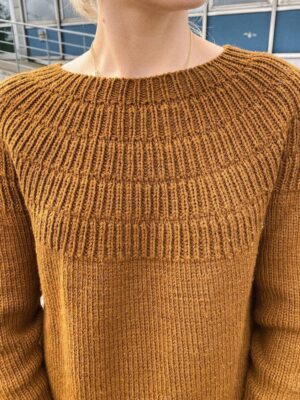 PetiteKnit Anker's Sweater - My Size is knitted in Sunday by Sandnes Garn in the color 2345. The color is discontinued and the closest match in our selection is the color 2543 brown sugar.