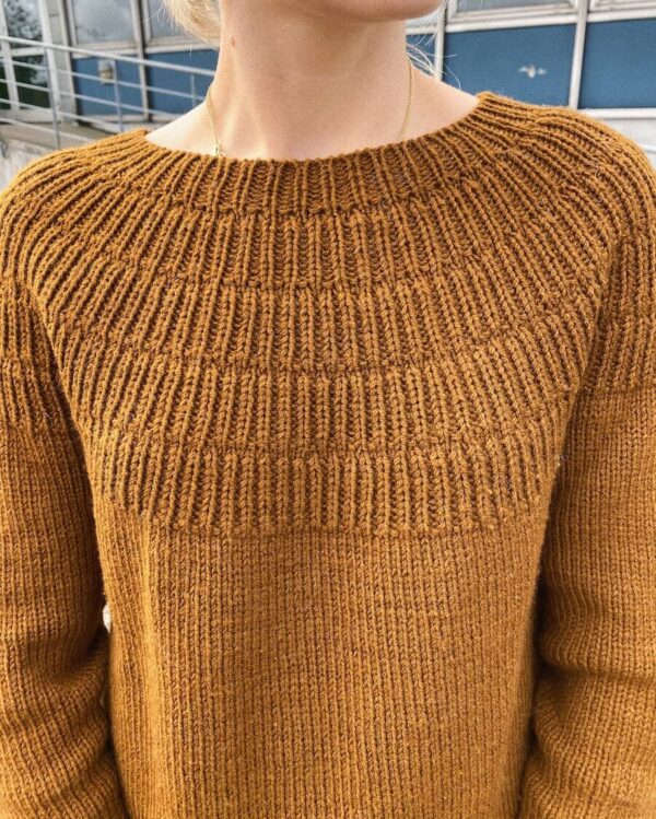 PetiteKnit Anker's Sweater - My Size is knitted in Sunday by Sandnes Garn in the color 2345. The color is discontinued and the closest match in our selection is the color 2543 brown sugar.
