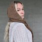 The Crown Hood Scarf by PoolaKnits is knitted in Ruukin kehräämö Alpakka in colorway Light Camel. The closest match in our selection is Sandnes Garn Alpakka Ull in color 2650 Grey Beige Heather.
