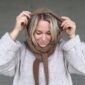 The Crown Hood Scarf by PoolaKnits is knitted in Ruukin kehräämö Alpakka in colorway Light Camel. The closest match in our selection is Sandnes Garn Alpakka Ull in color 2650 Grey Beige Heather.