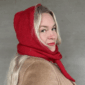 The Crown Hood Scarf by PoolaKnits is knitted in Drops Merino Extra Fine in colorway 11. The closest match in our selection is Sandnes Garn Alpakka Ull in color 4227 Equestrian Red.
