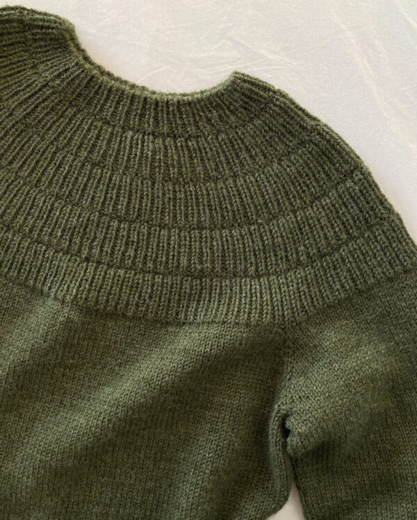PetiteKnit Anker’s Sweater My Boyfriend's Size is knitted in Peer Gynt in the color Dark Green Heather 9572 from Sandnes Garn. PetiteKnit Anker’s Sweater My Boyfriend's Size is knitted in Peer Gynt in the color Dark Green Heather 9572 from Sandnes Garn.