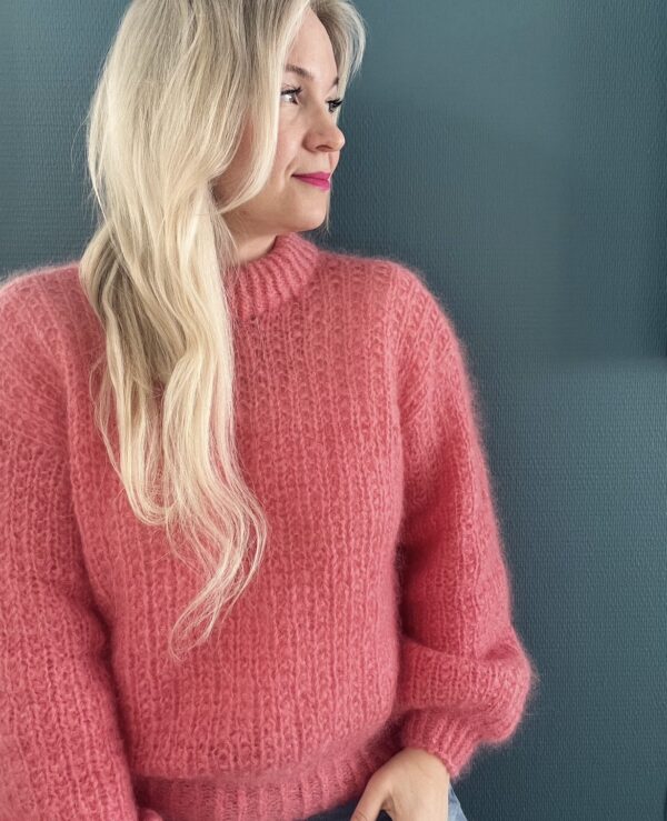 Magnolia by PoolaKnits is knitted in yarns that is not available in our store. The closest match in our selection is Sandnes Garn Alpakka Ull in color 4227 Equestrian Red.