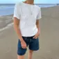 Het witte Cloud T-shirt is gebreid van Tynn Line van Sandnes Garn in de kleur Wit [1002].