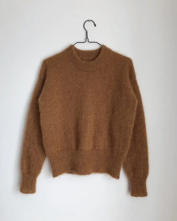 The light brown Stockholm Sweater is knitted in Silk Mohair by Isager in color 63. The light brown Stockholm Sweater is knitted in Silk Mohair by Isager in color 63.