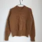 The light brown Stockholm Sweater is knitted in Silk Mohair by Isager in color 63.