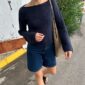 The blue Sevilla Blouse is knitted in Palet by Isager in color Navy held together with Trio 1 by Isager in the color Navy.