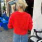 The red Stockholm Sweater V-Neck is knitted in Tynn Silk Mohair by Sandnes Garn in the color 4008 Poppy. The color is discontinued and the closest match in our selection is the color 4018 Scarlet Red.