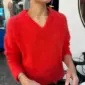 The red Stockholm Sweater V-Neck is knitted in Tynn Silk Mohair by Sandnes Garn in the color 4008 Poppy. The color is discontinued and the closest match in our selection is the color 4018 Scarlet Red.