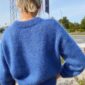 The blue Stockholm Sweater V-Neck is knitted in Silk Mohair by Isager in color 44.
