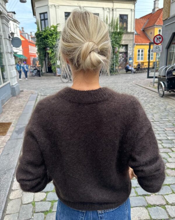 The dark brown Stockholm Sweater is knitted in Silk Mohair by Isager in color 34. The dark brown Stockholm Sweater is knitted in Silk Mohair by Isager in color 34.