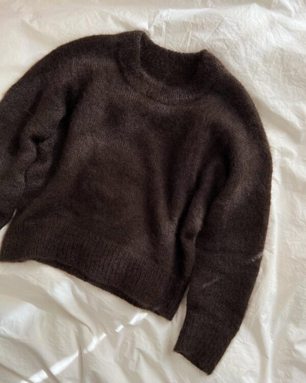 The dark brown Stockholm Sweater is knitted in Silk Mohair by Isager in color 34. The dark brown Stockholm Sweater is knitted in Silk Mohair by Isager in color 34.