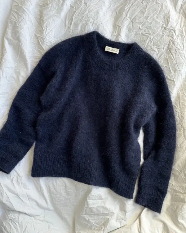 The blue Stockholm Sweater is knitted in Silk Mohair by Isager in color 100. The blue Stockholm Sweater is knitted in Silk Mohair by Isager in color 100.