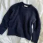 The blue Stockholm Sweater is knitted in Silk Mohair by Isager in color 100.