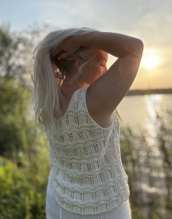 The white Tiny Dancer Top is knitted with Knitting for Olive Pure Silk in color Cream (two strands of yarn held together) The white Tiny Dancer Top is knitted with Knitting for Olive Pure Silk in color Cream (two strands of yarn held together)