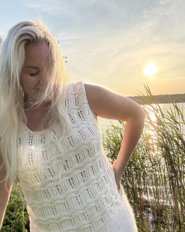 The white Tiny Dancer Top is knitted with Knitting for Olive Pure Silk in color Cream (two strands of yarn held together) The white Tiny Dancer Top is knitted with Knitting for Olive Pure Silk in color Cream (two strands of yarn held together)