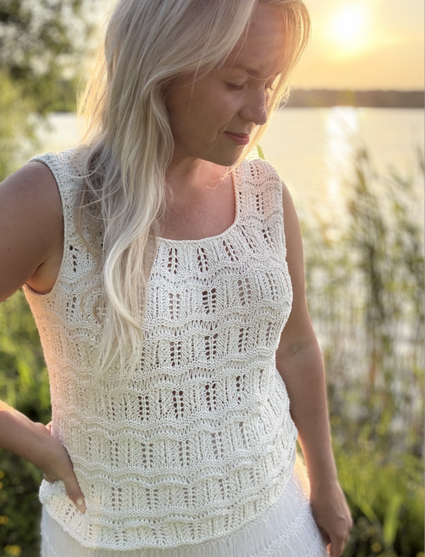 The white Tiny Dancer Top is knitted with Knitting for Olive Pure Silk in color Cream (two strands of yarn held together) The white Tiny Dancer Top is knitted with Knitting for Olive Pure Silk in color Cream (two strands of yarn held together)